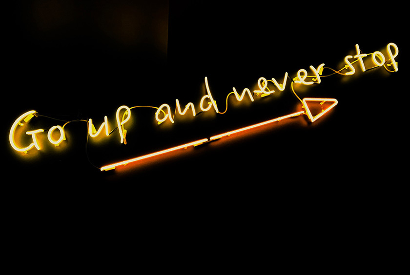 Go up and never stop illuminated sign